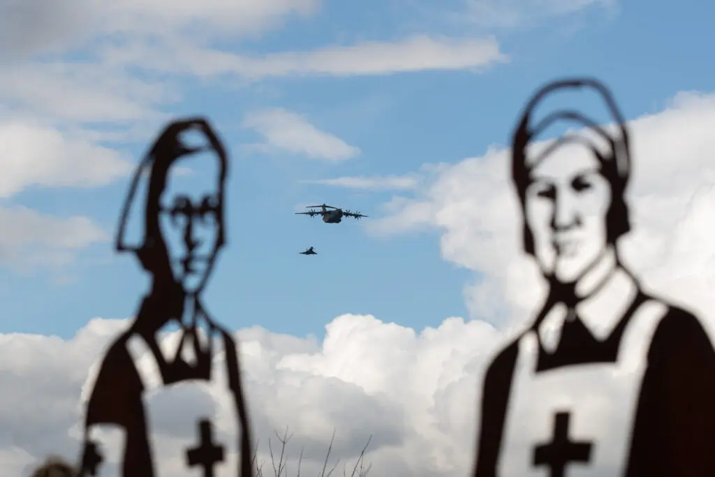 Two steel silhouettes in a colour photo