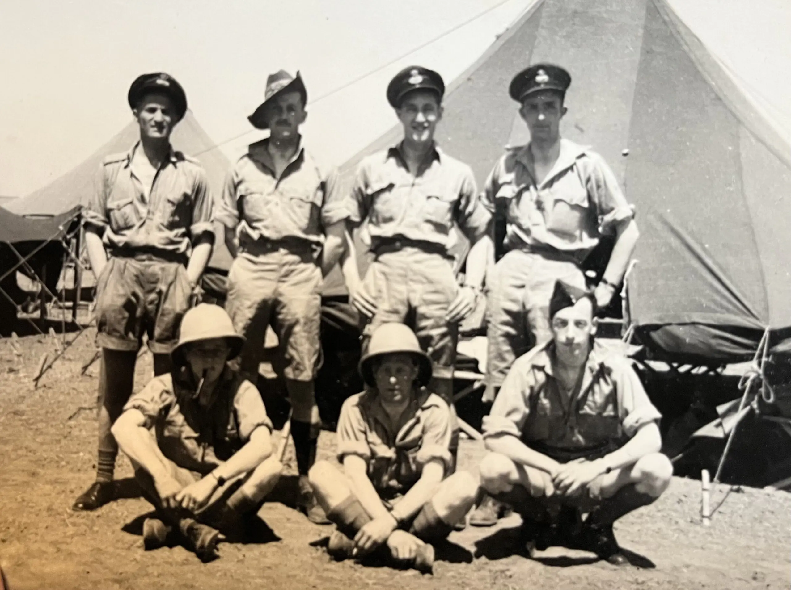 Black and white photo of 7 men in WW2 uniform